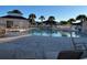 Community pool with lounge chairs and palm trees, offering a relaxing amenity for residents at 237 Cloverleaf Dr., Longs, SC 29568
