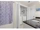 Bathroom with washer and dryer, granite countertop, and tiled shower at 508 21St Ave. N, North Myrtle Beach, SC 29582