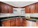 Kitchen corner with sink, granite countertops, and wooden cabinets at 508 21St Ave. N, North Myrtle Beach, SC 29582