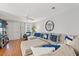 Spacious living room with sectional sofa, hardwood floors, and large TV at 508 21St Ave. N, North Myrtle Beach, SC 29582