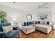 Living Room with sectional sofa, hardwood floors, and a ceiling fan at 508 21St Ave. N, North Myrtle Beach, SC 29582
