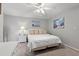 King-size bed, ceiling fan, and coastal-themed artwork in bedroom at 508 21St Ave. N, North Myrtle Beach, SC 29582