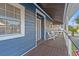 Upstairs porch with wooden flooring and white chairs at 508 21St Ave. N, North Myrtle Beach, SC 29582