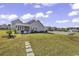Private backyard with screened porch and pond view at 217 Southern Breezes Circle, Murrells Inlet, SC 29576