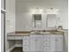 Double vanity bathroom with granite countertop and white cabinets at 217 Southern Breezes Circle, Murrells Inlet, SC 29576