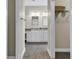 Double vanity bathroom with updated fixtures and ceramic tile at 217 Southern Breezes Circle, Murrells Inlet, SC 29576