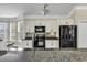 Updated kitchen with granite countertops and black appliances at 217 Southern Breezes Circle, Murrells Inlet, SC 29576