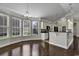 Eat-in kitchen with hardwood floors, white cabinets, and granite countertops at 217 Southern Breezes Circle, Murrells Inlet, SC 29576