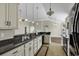 Modern kitchen with granite countertops and white cabinets at 217 Southern Breezes Circle, Murrells Inlet, SC 29576