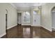 Bright living room with hardwood floors, large window, and neutral color palette at 217 Southern Breezes Circle, Murrells Inlet, SC 29576