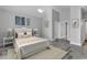 Main bedroom with plush carpet and access to private bath at 217 Southern Breezes Circle, Murrells Inlet, SC 29576