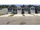 A row of charming townhomes with attached garages offers modern living and curb appeal at 259 Christiana Ln. # E, Myrtle Beach, SC 29579