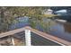 Backyard view from deck features waterfront with trees and charming neighborhood homes at 37 Geney Ln., Pawleys Island, SC 29585