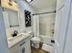 Modern bathroom with marble top vanity, black hardware, and tub and shower combo at 37 Geney Ln., Pawleys Island, SC 29585