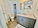 Bathroom with marble countertop, modern sink, and a well-organized closet at 37 Geney Ln., Pawleys Island, SC 29585