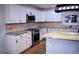 Kitchen featuring stainless steel appliances, granite countertops, white cabinets and center island at 37 Geney Ln., Pawleys Island, SC 29585