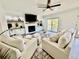 Bright living room features a fireplace, built-in shelving, and sliding doors to the outside at 37 Geney Ln., Pawleys Island, SC 29585