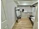 Walk-in closet with built-in shelving, vinyl flooring, and a hanging rod for clothes at 37 Geney Ln., Pawleys Island, SC 29585