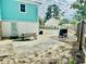 Backyard with a BBQ grill, picnic table, and potential for outdoor activities by the house at 3936 Murrells Inlet Rd., Murrells Inlet, SC 29576