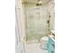 Beautifully remodeled bathroom with a glass enclosed shower with gold fixtures and pebble tile floor at 3936 Murrells Inlet Rd., Murrells Inlet, SC 29576