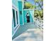 View of covered deck area with grey composite decking and a pelican carving on the siding at 3936 Murrells Inlet Rd., Murrells Inlet, SC 29576