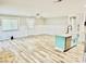 Inviting living room with stylish plank flooring, a kitchen island, and bright natural light at 3936 Murrells Inlet Rd., Murrells Inlet, SC 29576