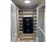 Spacious walk-in closet with built-in shelving and a safe for valuables at 3936 Murrells Inlet Rd., Murrells Inlet, SC 29576