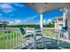 Inviting balcony featuring a table, chairs, and scenic golf course views at 4879 Dahlia Ct. # 204, Myrtle Beach, SC 29577