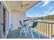 Relaxing balcony with seating, ceiling fan, and golf course view at 4879 Dahlia Ct. # 204, Myrtle Beach, SC 29577