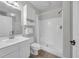 Clean white bathroom includes a vanity and shower/tub combination with tile floors at 4879 Dahlia Ct. # 204, Myrtle Beach, SC 29577