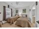 This bedroom features twin beds and is decorated with framed art and a light fixture over the window at 4879 Dahlia Ct. # 204, Myrtle Beach, SC 29577