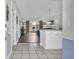 Entryway to living room with wood-look floors and sliding doors to patio at 4879 Dahlia Ct. # 204, Myrtle Beach, SC 29577