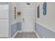 Entryway view with white door, neutral flooring, and chair rail at 4879 Dahlia Ct. # 204, Myrtle Beach, SC 29577