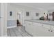 Partial kitchen view with white cabinetry and tiled floors at 4879 Dahlia Ct. # 204, Myrtle Beach, SC 29577
