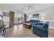 Living room with blue furniture, wood floors, and sliding doors to balcony at 4879 Dahlia Ct. # 204, Myrtle Beach, SC 29577