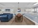 Open living space with dining area and blue couch with nautical decor at 4879 Dahlia Ct. # 204, Myrtle Beach, SC 29577