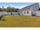 Expansive backyard offers a lush lawn and a patio ideal for outdoor entertaining and relaxation at 263 Red Maple Loop, Longs, SC 29568
