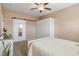 Neutral bedroom with a ceiling fan, a wardrobe and a sliding barn door with a full-length mirror at 263 Red Maple Loop, Longs, SC 29568