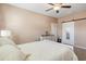 Bright bedroom with a ceiling fan, a white dresser and a sliding barn door with a full-length mirror at 263 Red Maple Loop, Longs, SC 29568