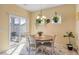 Dining area features a wooden table, chandelier, and sliding door to the outside at 263 Red Maple Loop, Longs, SC 29568