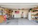 Attached garage with shelving, ample storage space, and well-lit interior at 263 Red Maple Loop, Longs, SC 29568
