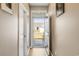 A hallway view looking out to the front yard through an open screen door at 263 Red Maple Loop, Longs, SC 29568