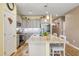 A kitchen with hardwood floors, gray cabinets and stainless steel appliances at 263 Red Maple Loop, Longs, SC 29568