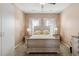 Bedroom with a neutral color palette, a ceiling fan, and large windows with natural light at 263 Red Maple Loop, Longs, SC 29568