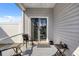 Cozy patio area with outdoor seating, ideal for enjoying the backyard and fresh air at 263 Red Maple Loop, Longs, SC 29568