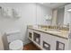 Bathroom featuring a granite vanity, sink, and toilet at 1205 S Ocean Blvd. # 20702, Myrtle Beach, SC 29577