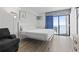 This comfortable bedroom has a queen bed and access to a balcony with ocean views at 1205 S Ocean Blvd. # 20702, Myrtle Beach, SC 29577