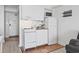 Compact white kitchen with tile floor, stove, and refrigerator at 1205 S Ocean Blvd. # 20702, Myrtle Beach, SC 29577