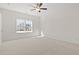 Spacious carpeted bedroom with natural light and a ceiling fan at 299 Hayloft Circle, Conway, SC 29526