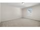 Neutrally decorated bedroom featuring plush carpeting and natural light from the window at 299 Hayloft Circle, Conway, SC 29526
